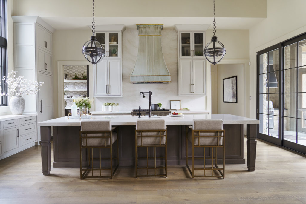 Luxurious Southern kitchen with island and three seating spots.