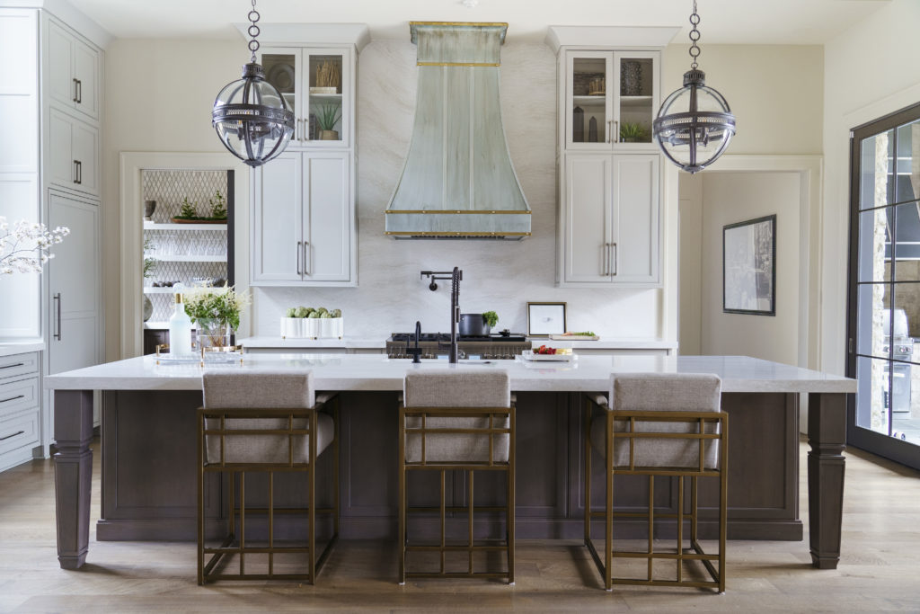 Luxurious Southern kitchen with island and three seating spots.