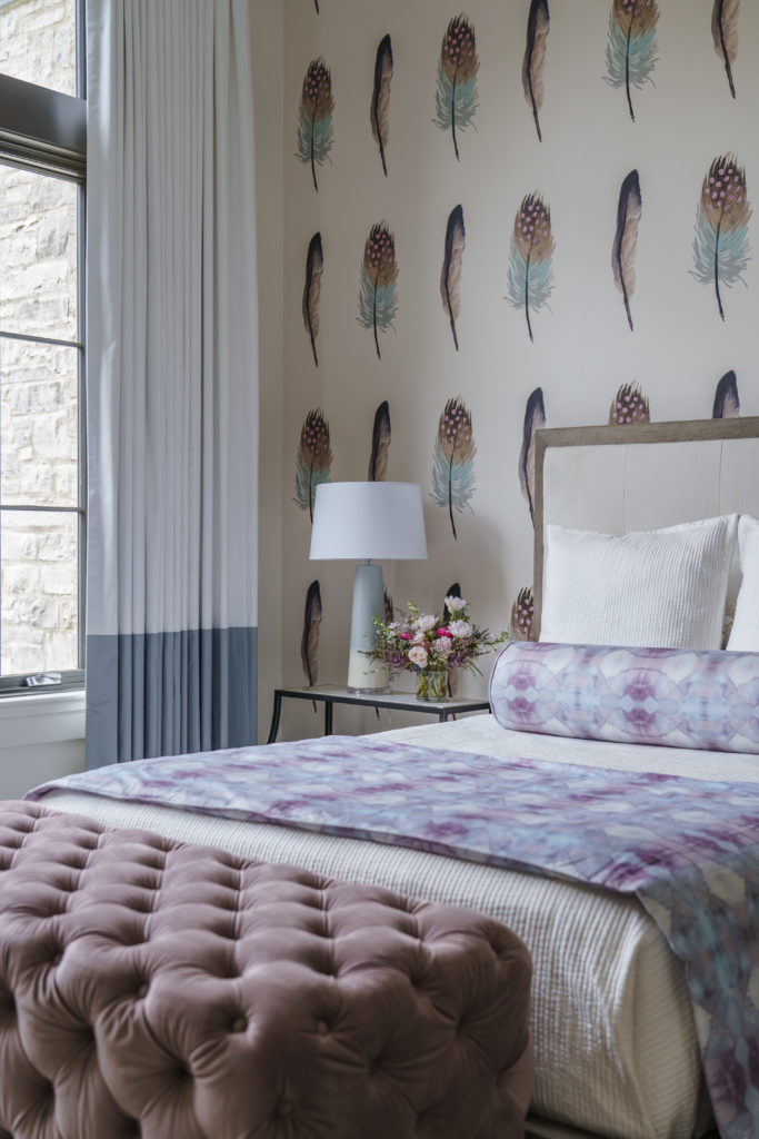 Image showcasing a bedroom with artfully wallpapered walls, featuring a captivating pattern and harmonious color palette.