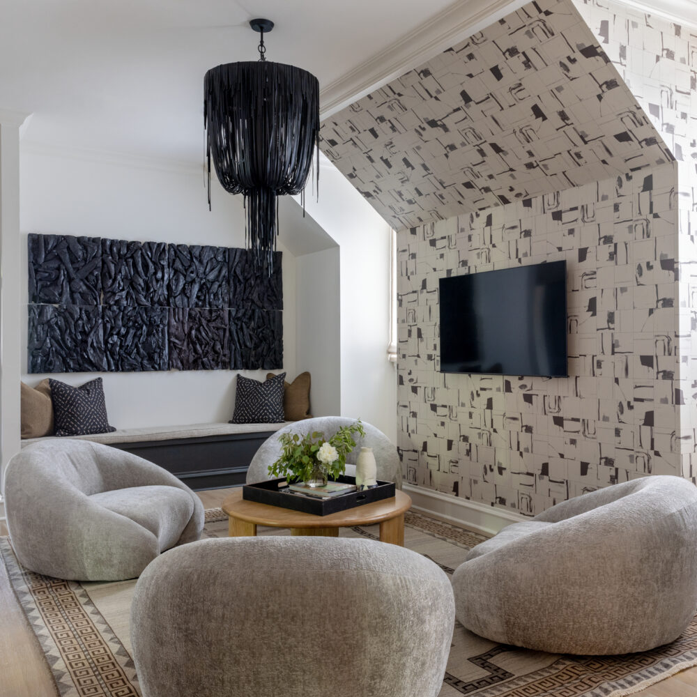 Intimate living space with bold decor and striking wallpaper.