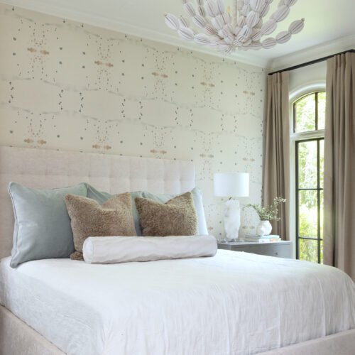 An enchanting bedroom adorned with a chandelier, transforming into a striking art piece.